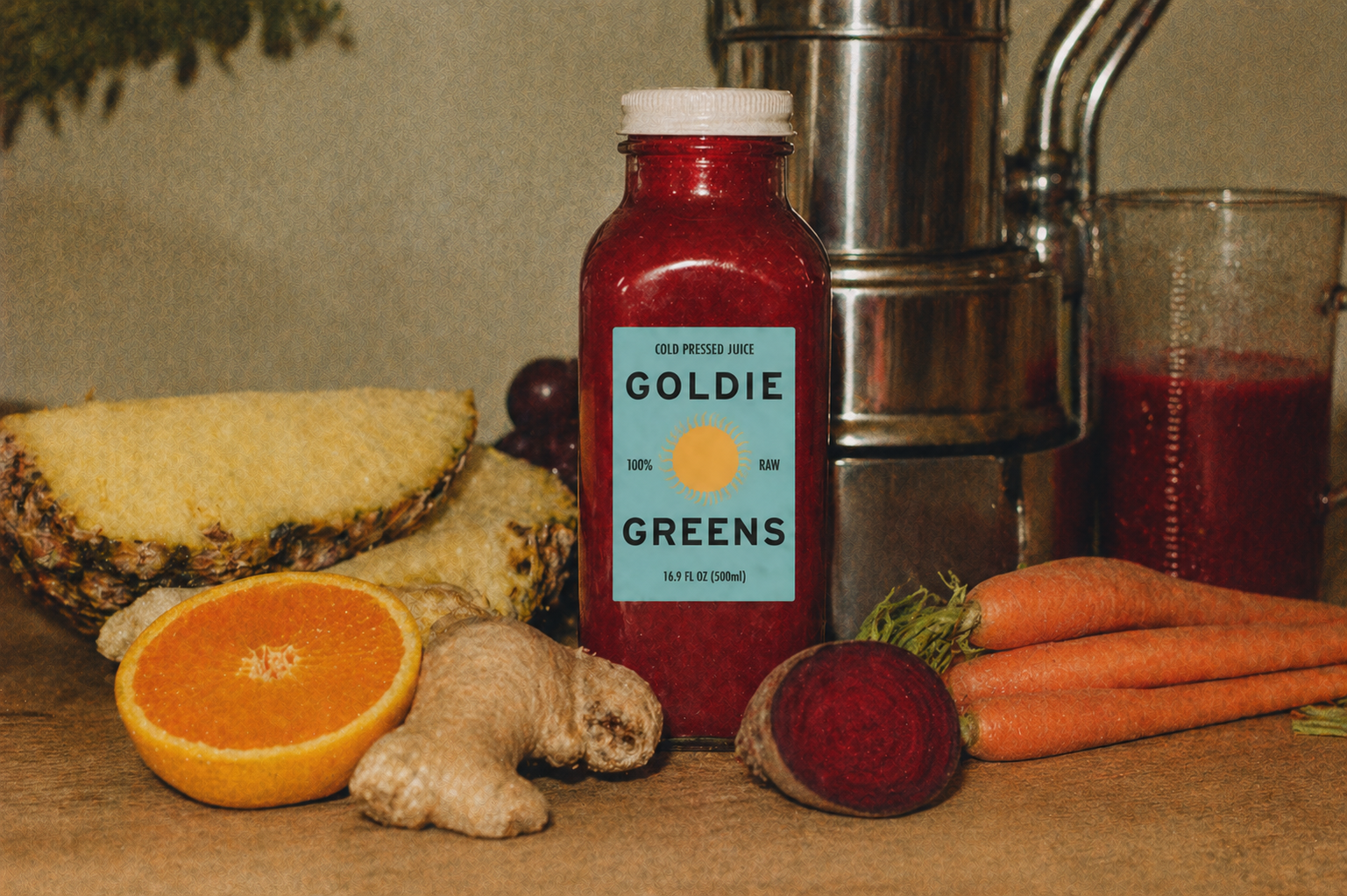 A bottle of Merry + Bright juice in warm light, surrounded by oranges, carrots, and a freshly pressed mound of citrus zest.